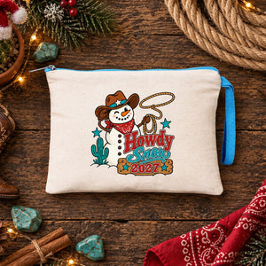 Cream clutch with a turquoise zipper and a Howdy Snow 2027 cowboy snowman print on rustic wood with a cowboy boot ornament and rope