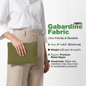 Real photo of a model holding the olive green cotton gabardine clutch, 6 x 8.3 inches (21 x 15 cm) with a metal zipper