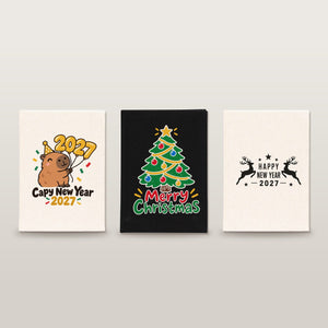 Studio photo of three canvas notebooks with Capy New Year 2027, Merry Christmas tree and Happy New Year 2027 reindeer prints