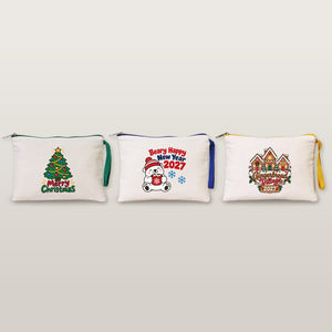 Studio photo of three cotton clutches with Merry Christmas tree, Beary Happy New Year 2027 and Gingerbread Village 2027 prints