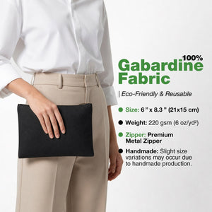 Real photo of a model holding the black cotton gabardine clutch, 6 x 8.3 inches (21 x 15 cm) with a metal zipper