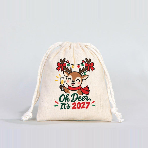 Real studio photo of a 4 x 5 inch natural cotton drawstring pouch with a natural cord, printed with the Oh Deer It's 2027 reindeer design