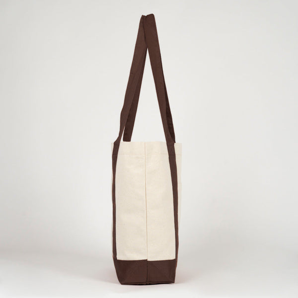 Side profile of the canvas tote with dark brown handle - Pamusan.com
