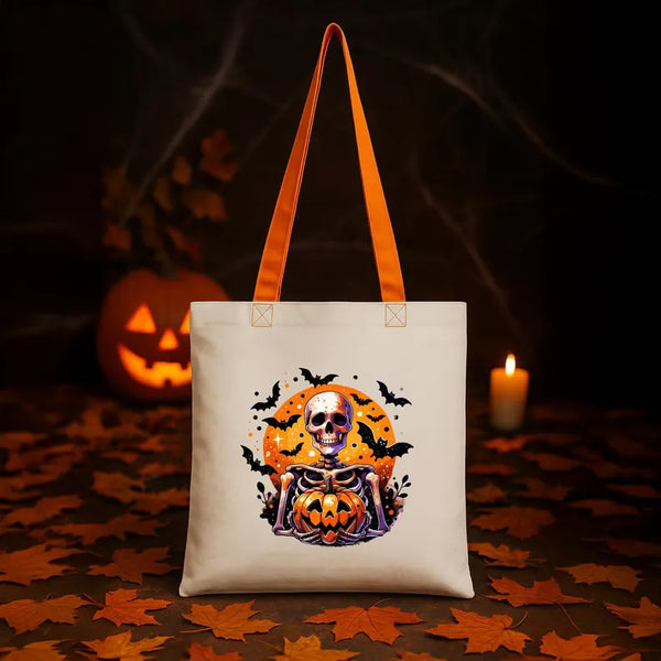 Tote bag with Halloween design featuring a skeleton and pumpkin on a dark background with pumpkins and candles.